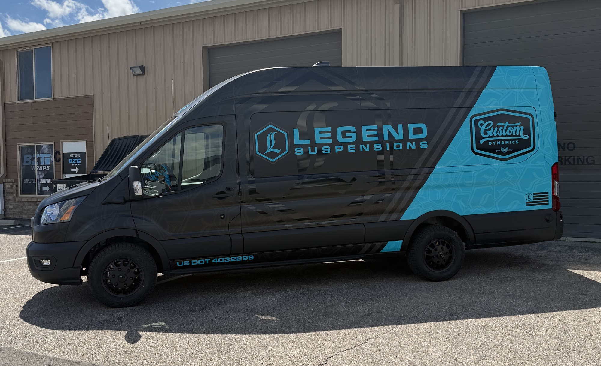 Black and cyan Legend Suspensions commercial van wrap