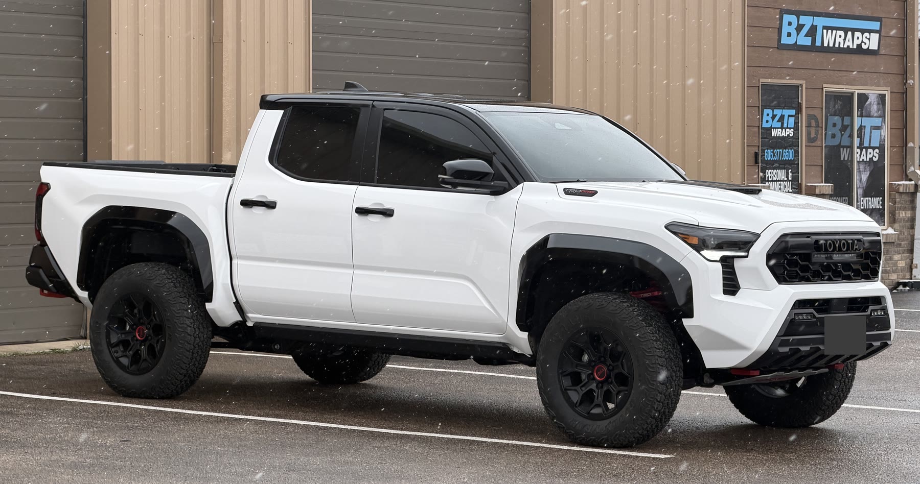 White Toyota pickup outside the BZT Wraps shop after full-body PPF work